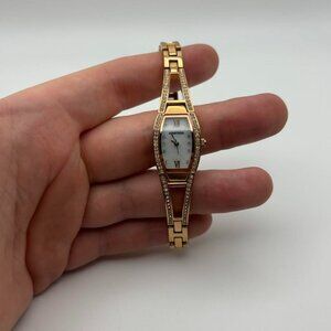 Vintage white face women’s Armitron watch with gold clasping band!
